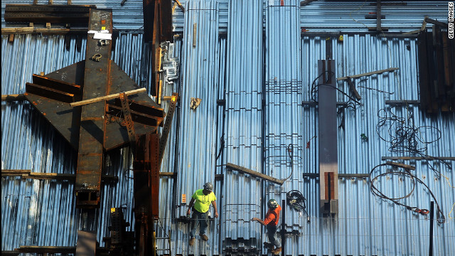 Only two of the four planned office towers for the site have had finishing beams placed on their top floors.