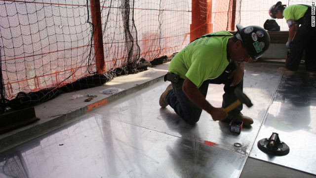Construction workers work on the 72nd floor at Four World Trade Center on Friday.