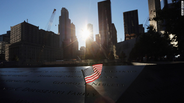 A flag sits in a name on the 9/11 Memorial on Tuesday, September 11 before ceremonies marking the eleventh anniversary of the terrorist attacks begin.